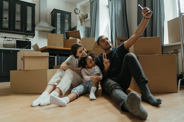 A family taking a picture while moving house